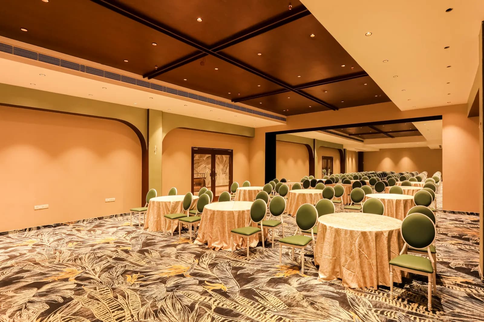 Savaya Banquets laid with linen-dressed round tables for a reception