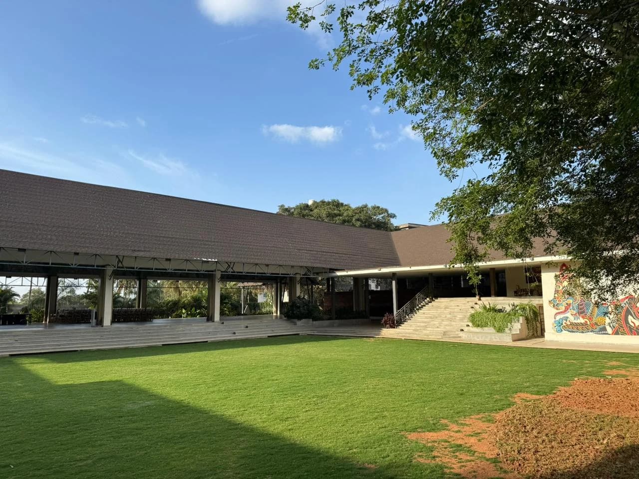 Padma Lawns framed by the open pavilion and Maya Dining Deck
