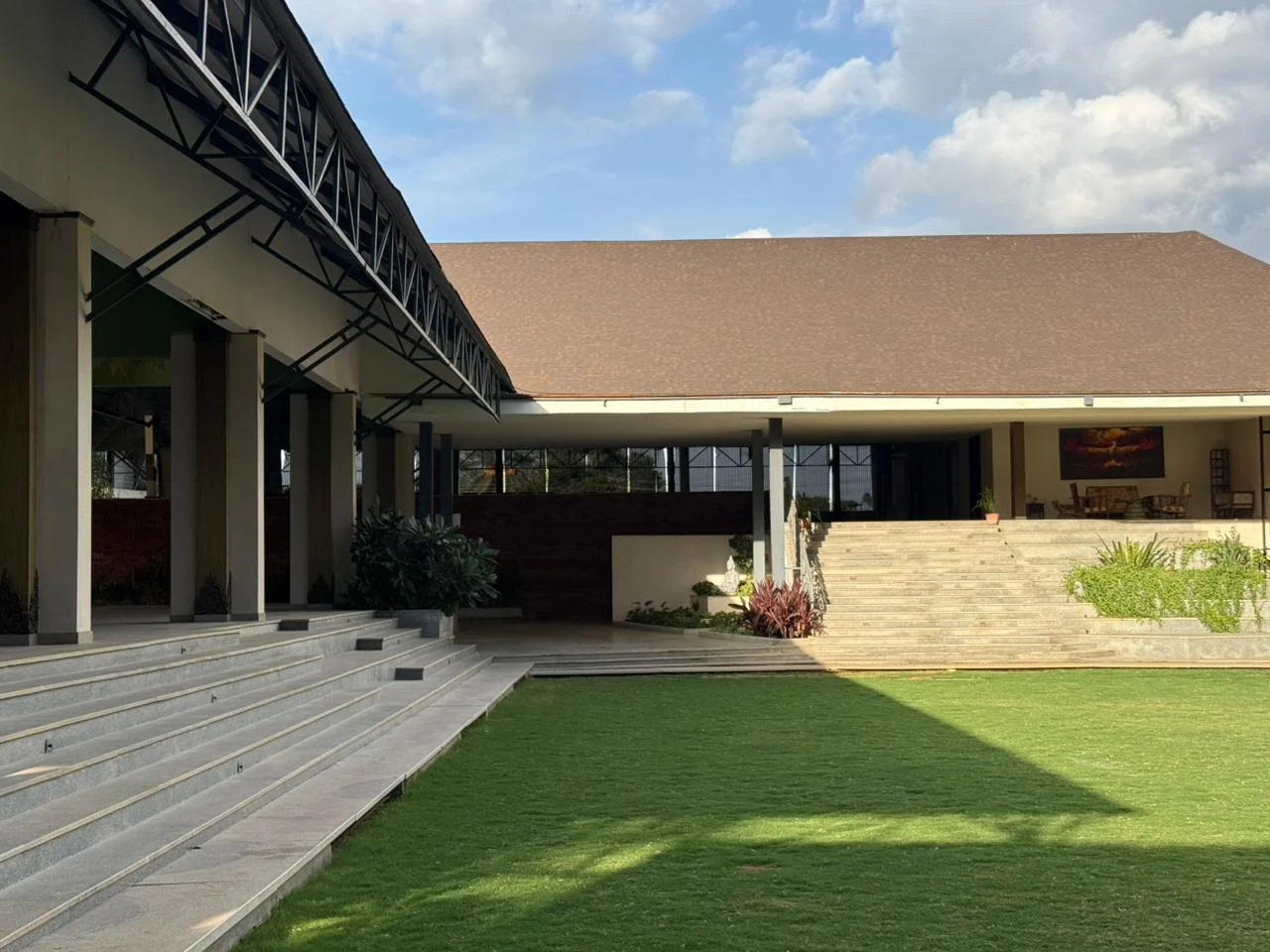 Padma Pavilion’s open sides and steps leading down to the lawn