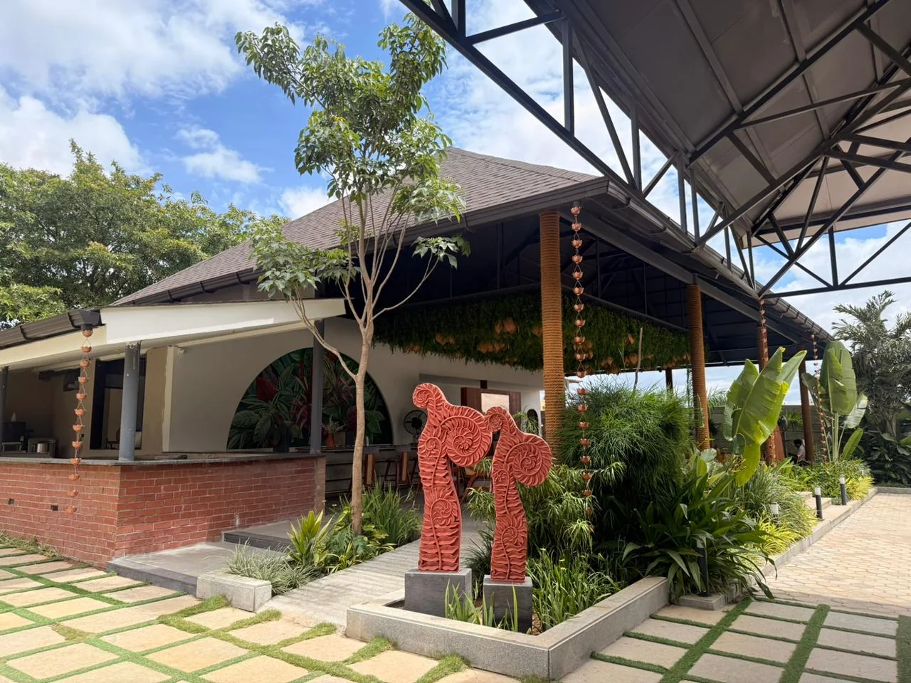 Restaurant and reception exterior with the red elephant sculpture
