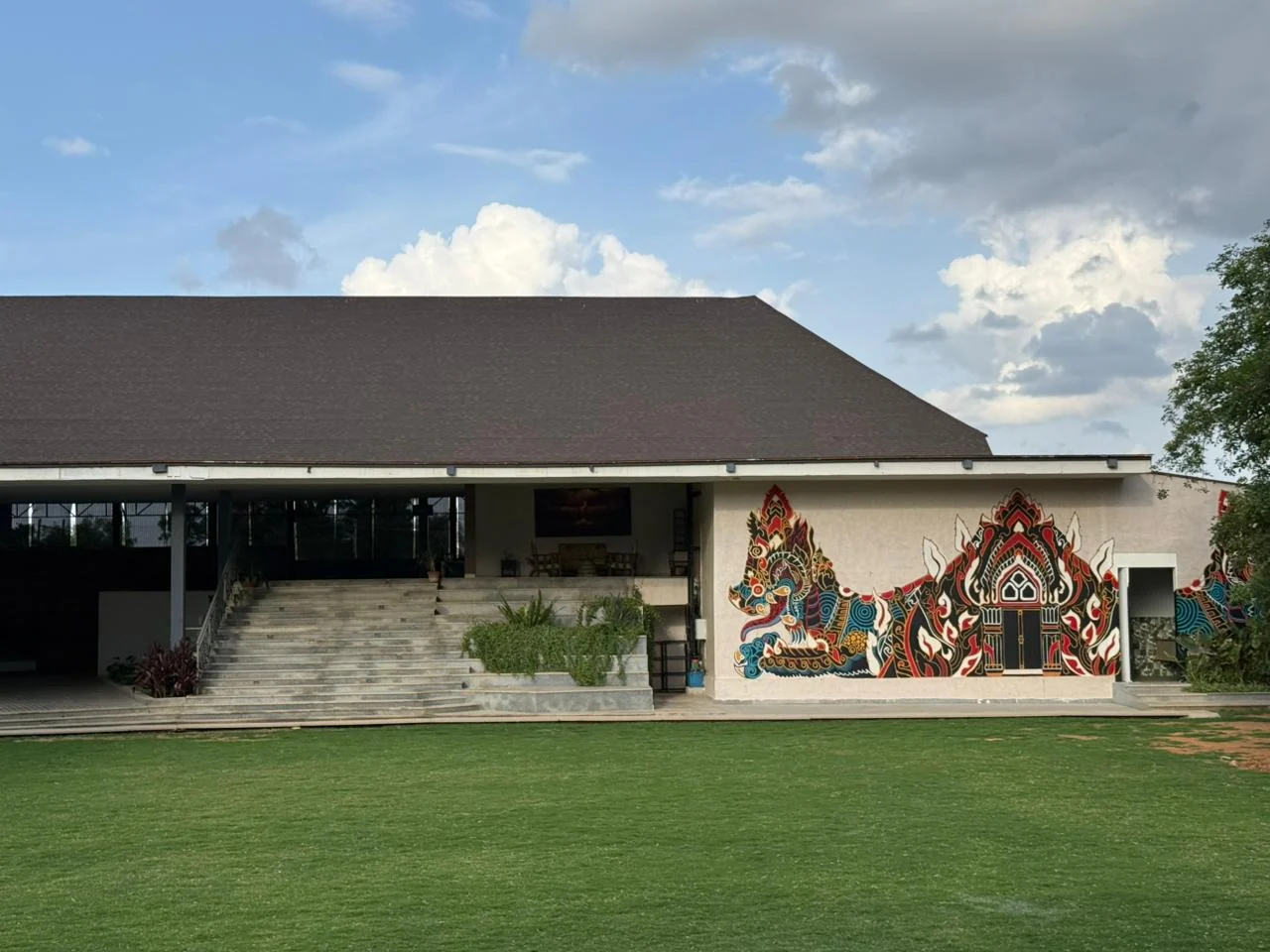 Maya Dining Deck’s lawn-facing steps and exterior mural